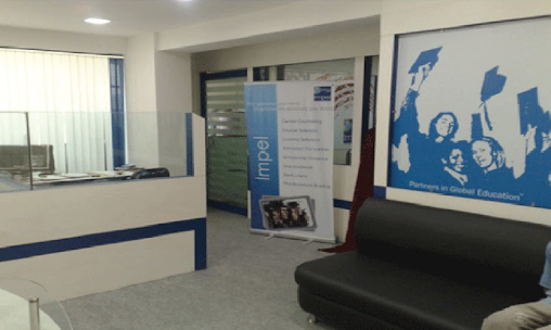 Impel Suryapet centre — Impel reception with Partners in Global Education banner